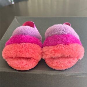 UGG Kids' Fluff Yeah Slide slippers in the pink/purple rainbow color.